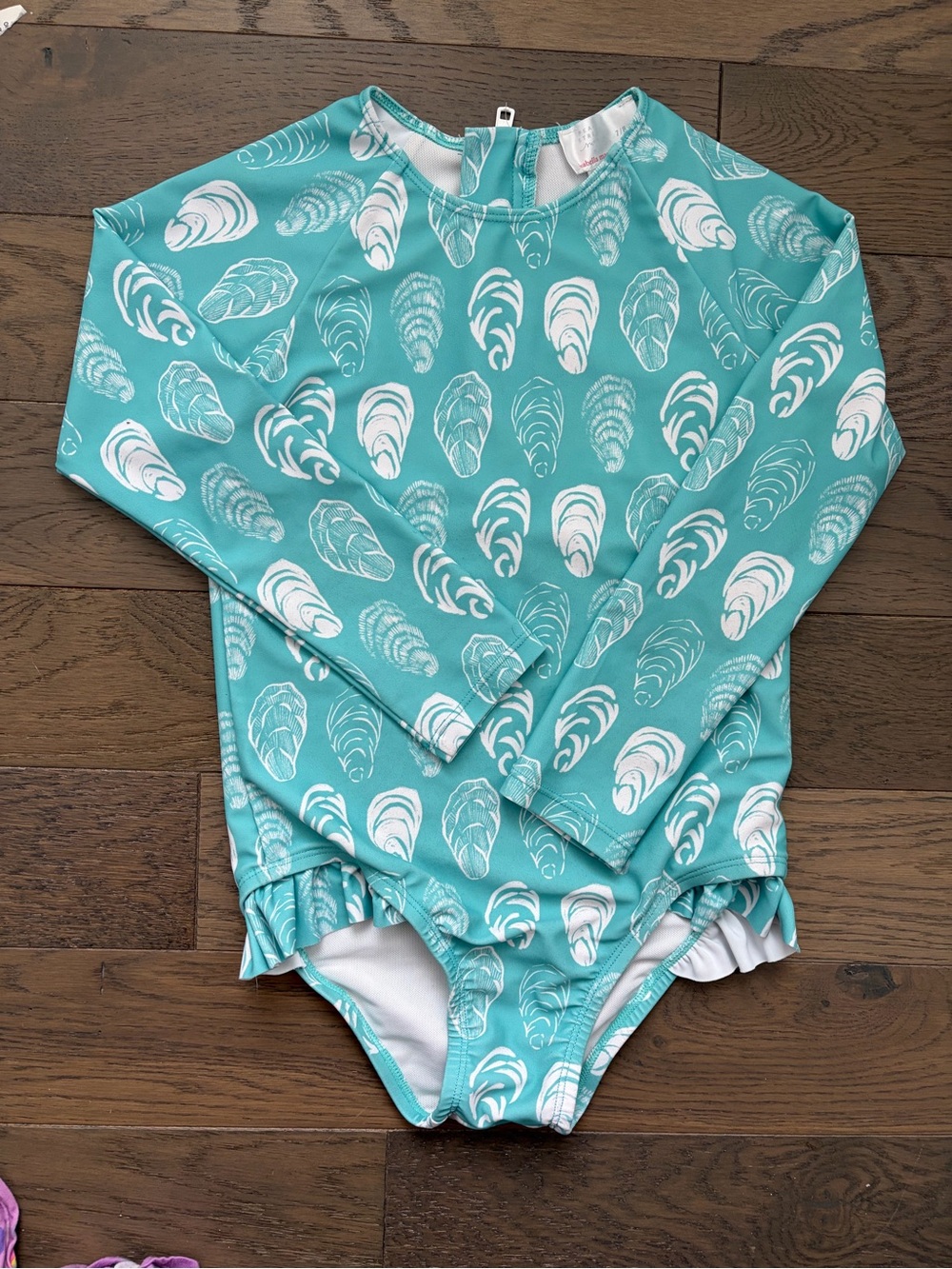 Kids Long-Sleeve One-Piece Rash Guard Swimsuit in Teal Shell Print